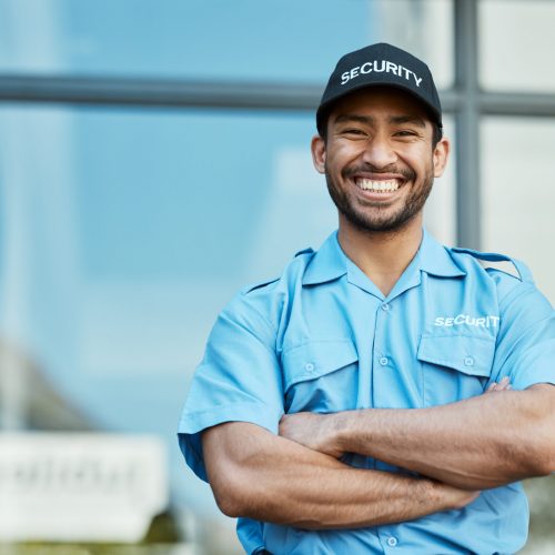 Happy man, portrait and security guard with arms crossed in city for career safety or outdoor protection. Male person, police or officer smile in confidence, law enforcement or patrol in urban town Happy man, portrait and security guard with arms crossed in city for career safety or outdoor protection. Male person, police or officer smile in confidence, law enforcement or patrol in urban town.